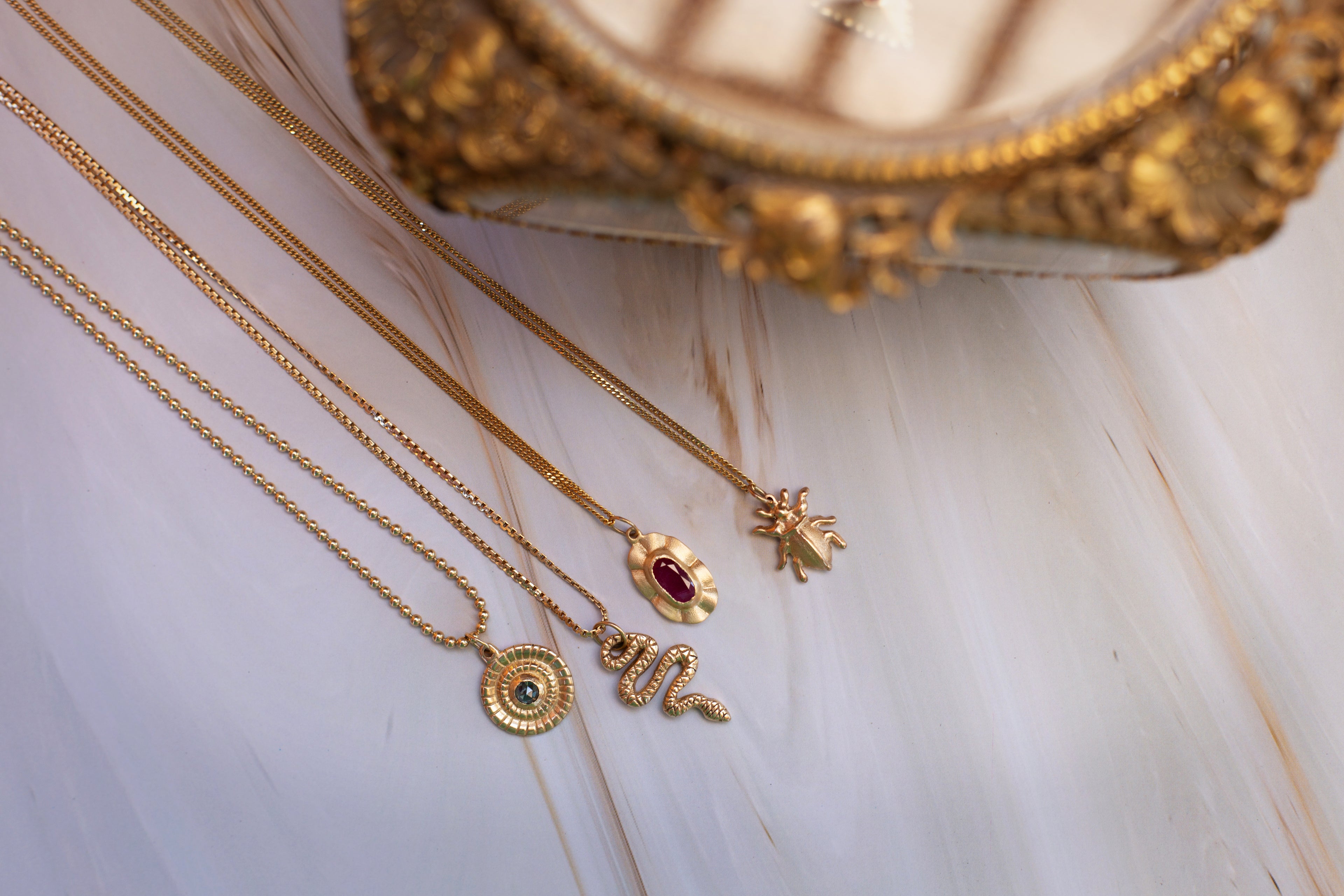 gold pendants sapphire ruby snake beetle